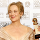Meryl Streep holding the Golden Globe for her role in The Devil Wears Prada.